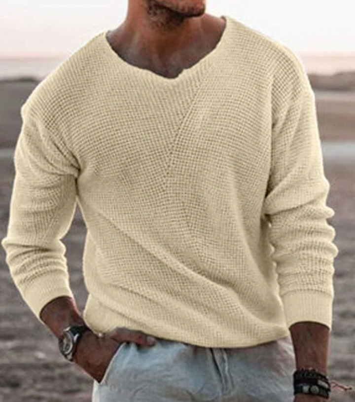 Men's relaxed fit waffle-knit v-neck sweater. Long-sleeve pullover for cozy fall and winter style.