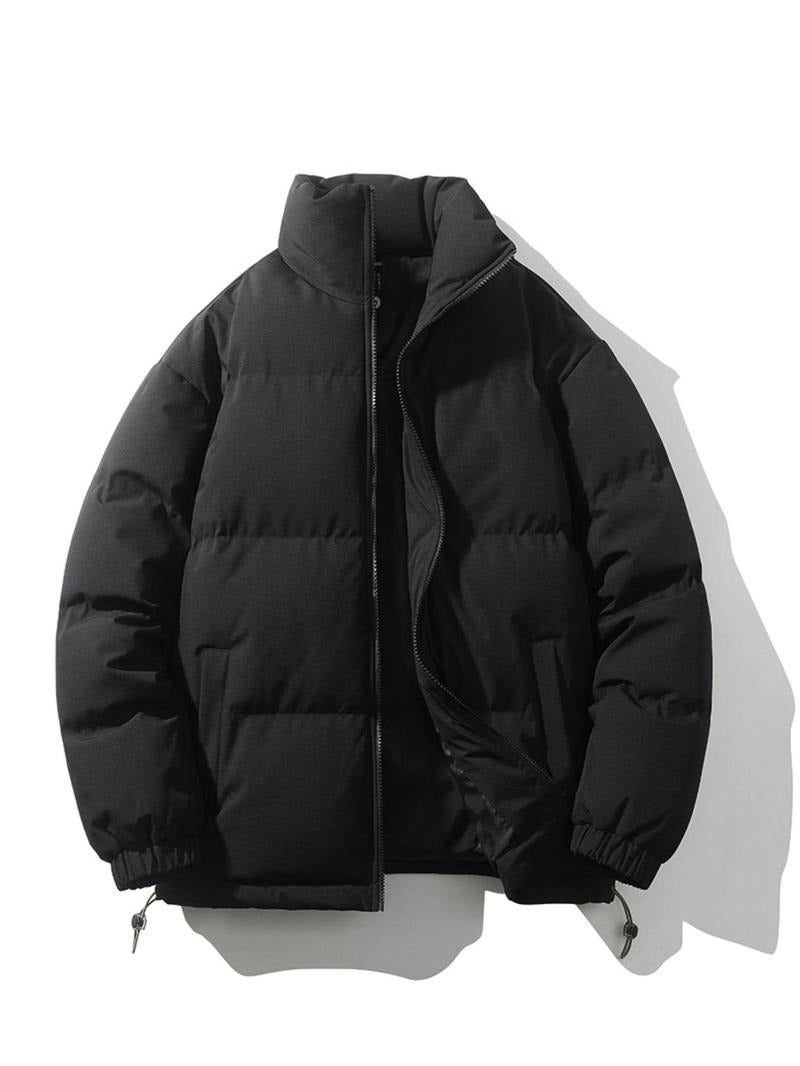 Men's sleek black puffer jacket. Insulated polyester winter coat. Casual outerwear.