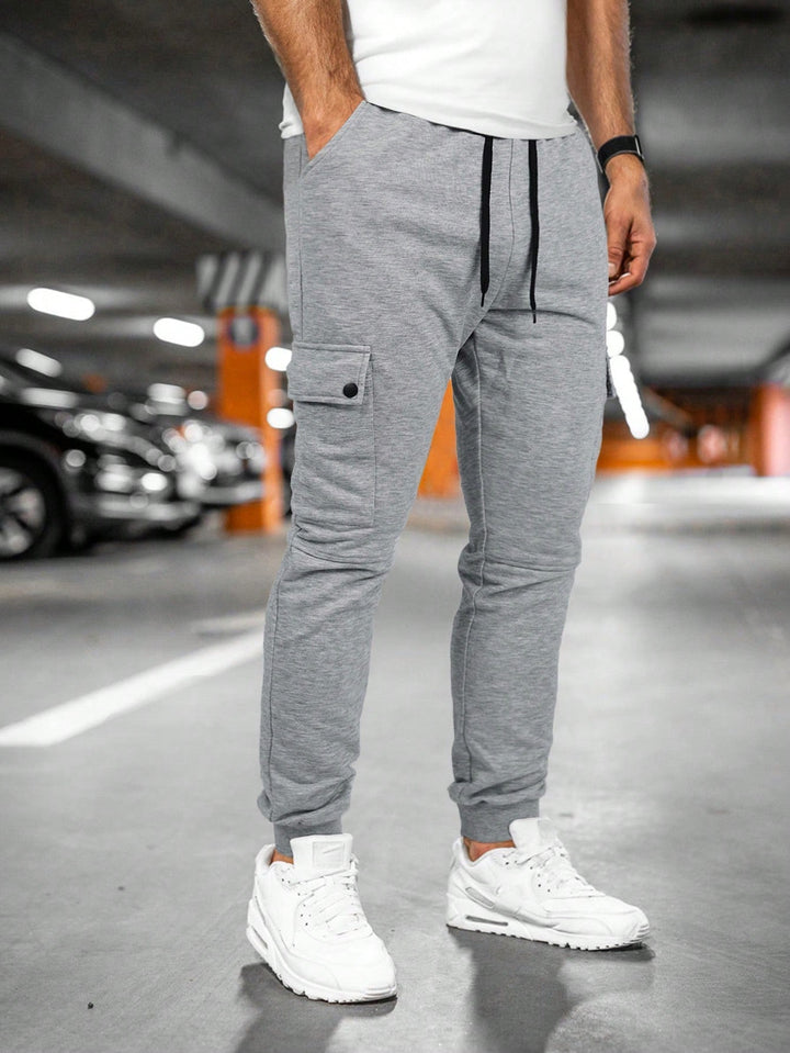 Slim-fit men's jogger pants, combining comfort, style, and essential streetwear functionality.