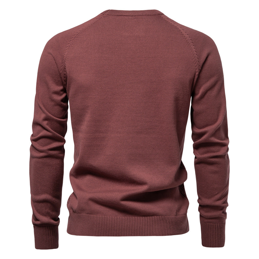 Close-up of the hemline and waffle knit detail of the men's cotton blend crewneck sweater