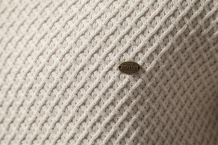 Detailed view of the cuffs of the men's long sleeve waffle knit crewneck sweater, cotton blend