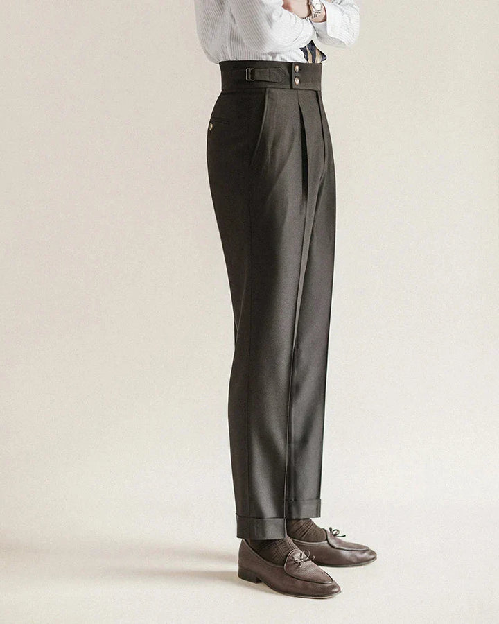 Model wearing men's tailored black business trousers, paired with a shirt for a complete office look.