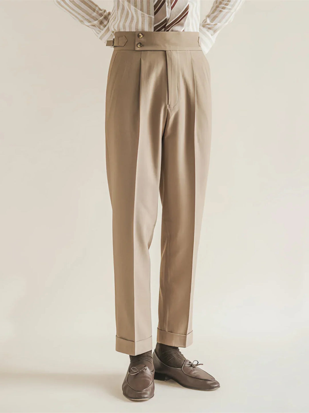 Side profile of men's slim-fit tailored grey trousers, emphasizing the cut for business attire.
