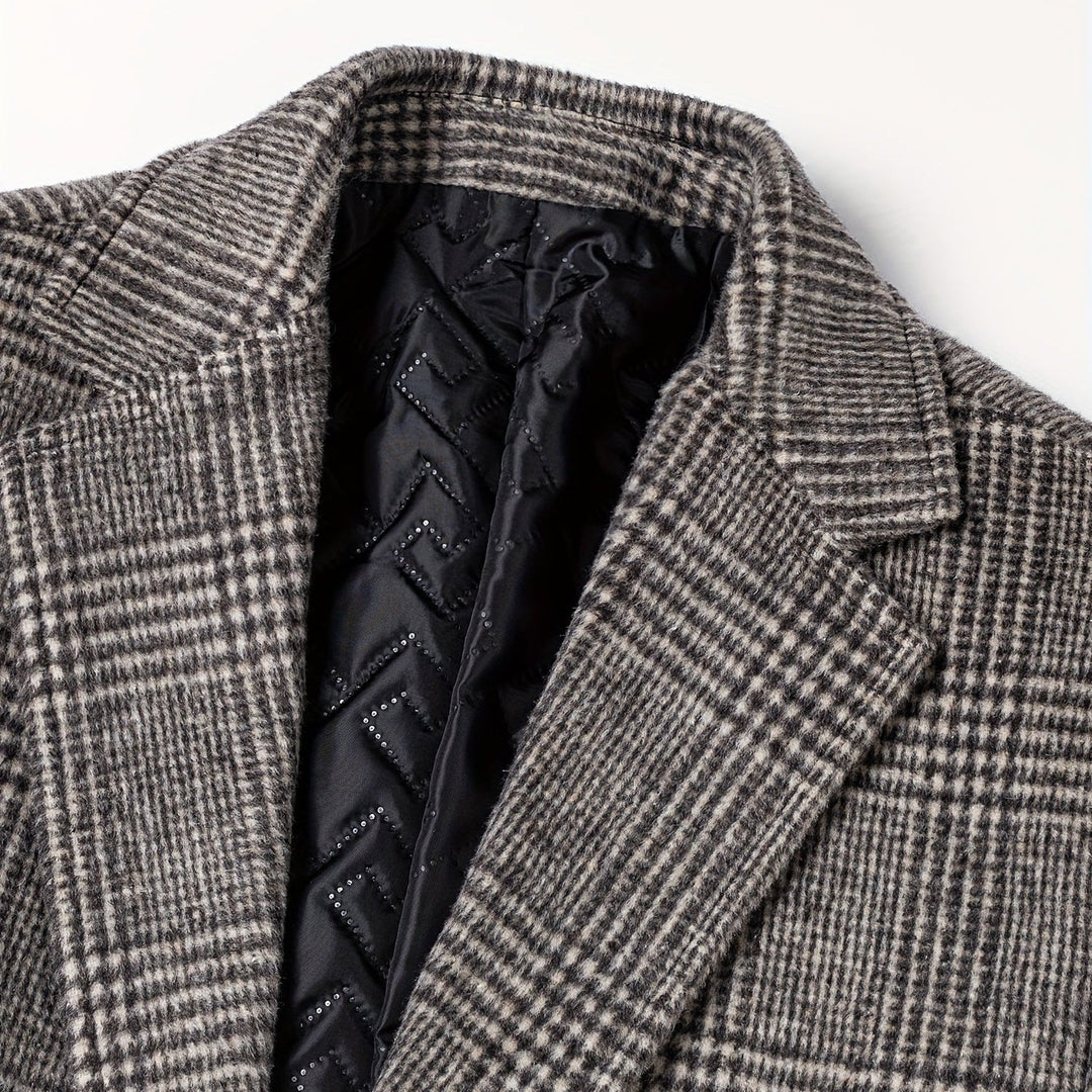 Full shot of a man wearing a classic gray plaid wool blend overcoat, perfect for cold weather