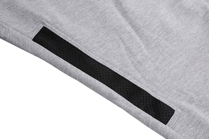 Group of men's tapered athletic joggers stacked, highlighting color variety