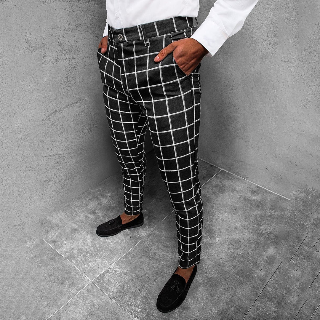 Stylish men's tapered grid pattern trousers in gray, ideal for modern office wear.
