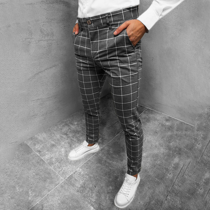 Men's fashionable tapered grid pattern trousers paired with a shirt, chic business casual.