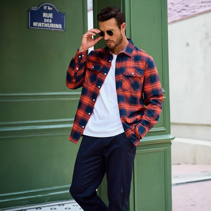 Man hiking in a Men's Verona Plaid Flannel Shirt, green and brown plaid, active outdoor apparel.