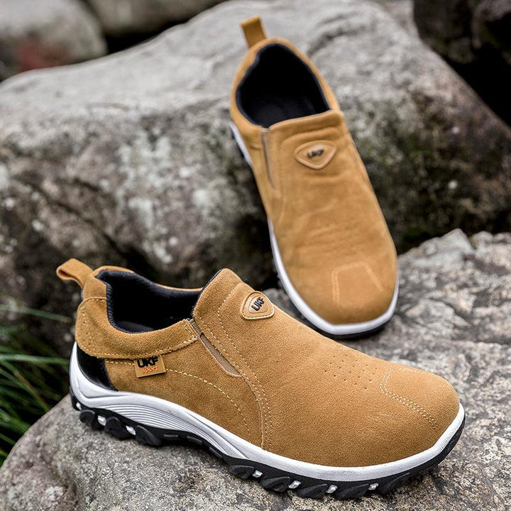 Pair of men's waterproof slip-on sneakers designed for multi-terrain outdoor use