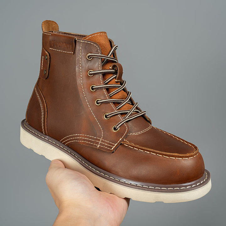 Close-up of men's black waterproof chukka boots, highlighting the durable material and ankle height.