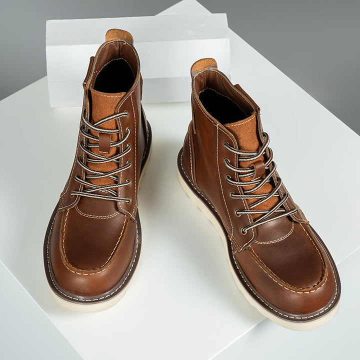 Front view of men's waterproof brown chukka boots, emphasizing the lacing and quality craftsmanship.