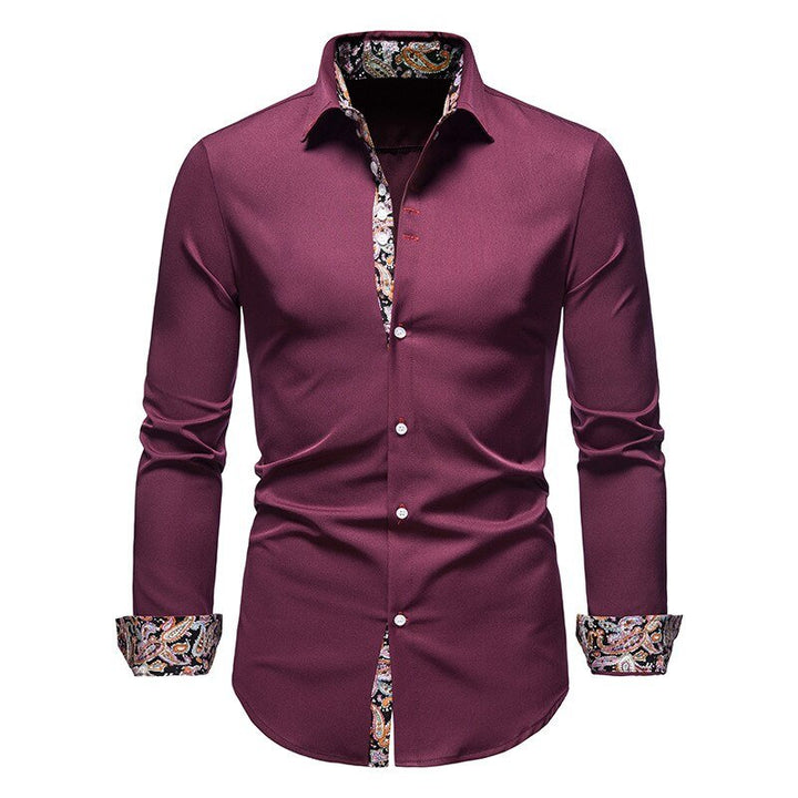 A crisp white men's shirt with decorative floral patterned cuffs, ideal for fashion-forward looks.