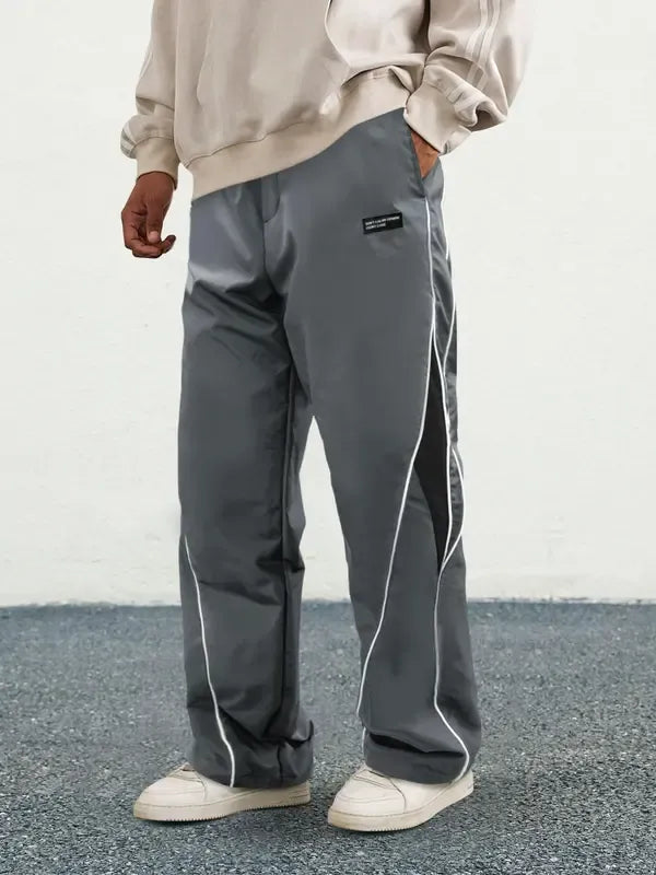 Side view of black men's athletic track pants, perfect for sportswear and casual wear.