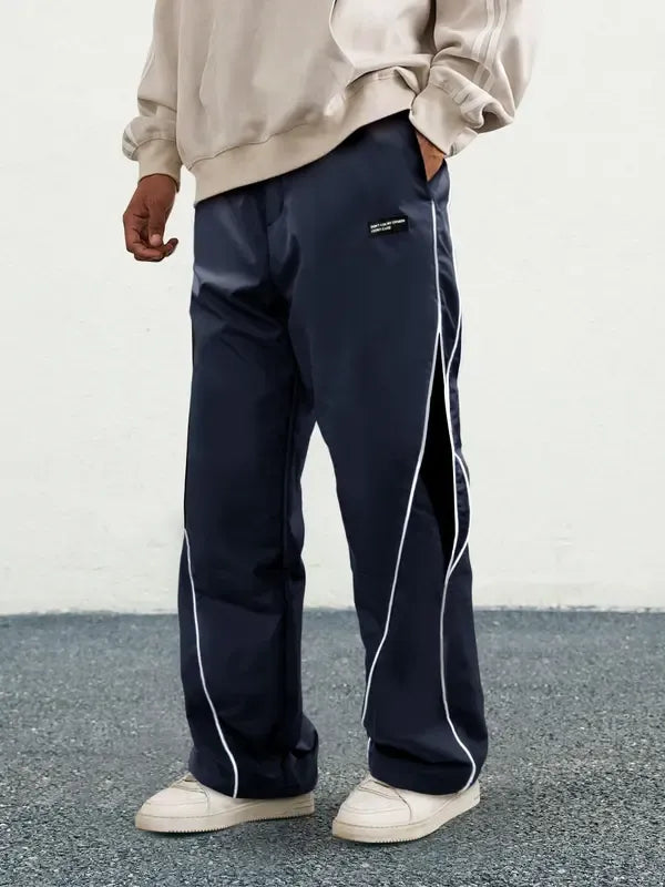 Woven track pants for men, featuring a comfortable design suitable for various activities.