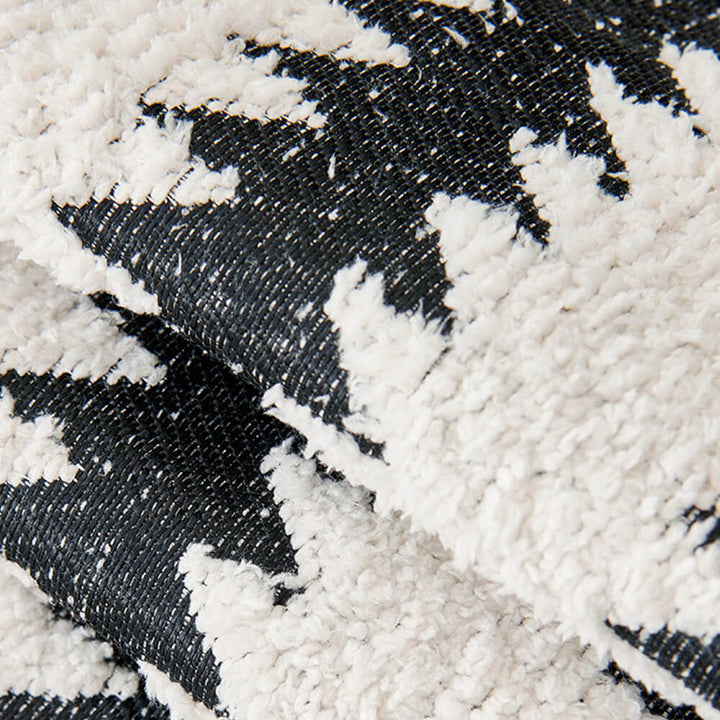Modern chevron stripe sofa cover with wavy edges. Protects furniture, updates living room decor.