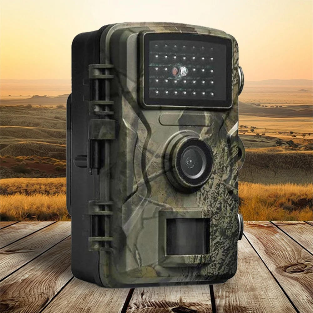"Outdoor night vision wildlife trail camera capturing nocturnal wildlife with 16MP photos and HD videos in rugged terrain."