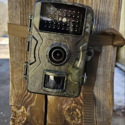 "Outdoor night vision wildlife trail camera capturing nocturnal wildlife with 16MP photos and HD videos in rugged terrain."