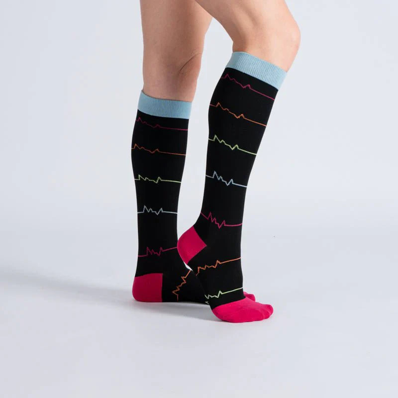 Close-up of a single midnight pink compression sock, highlighting soft fabric and support design