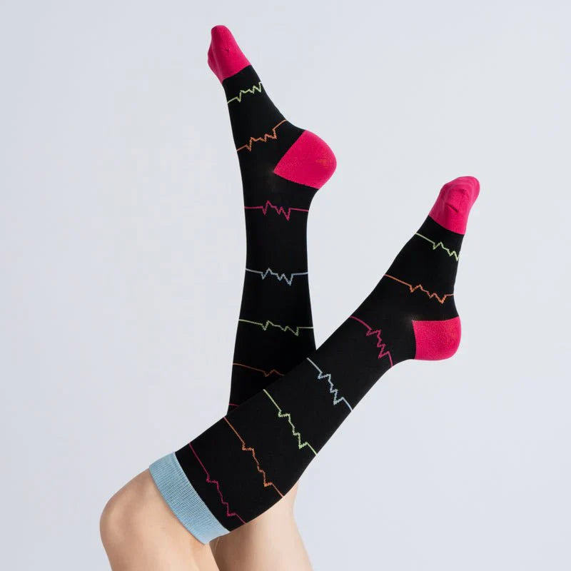 Midnight pink unisex compression socks on a white background, promoting circulation and support