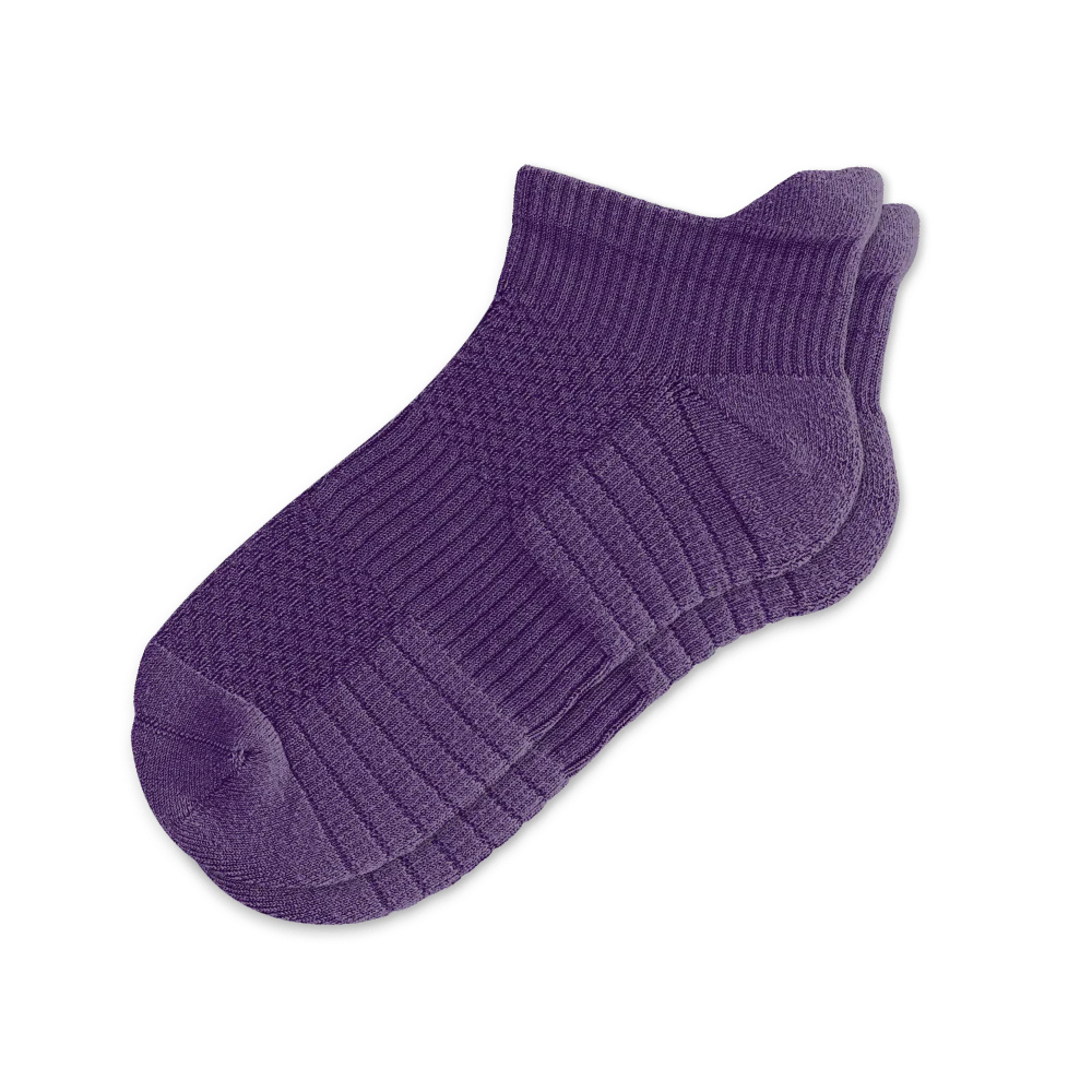 Pair of royal purple unisex ankle compression socks, isolated, for enhanced circulation and support.
