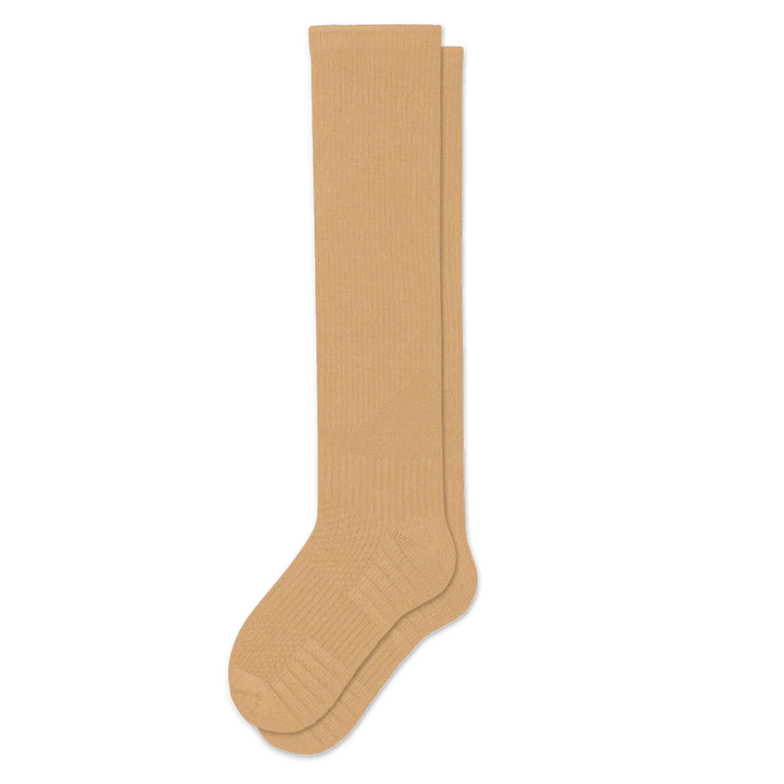 Tan gentle compression socks, unisex design, providing comfortable support for leg health and travel.