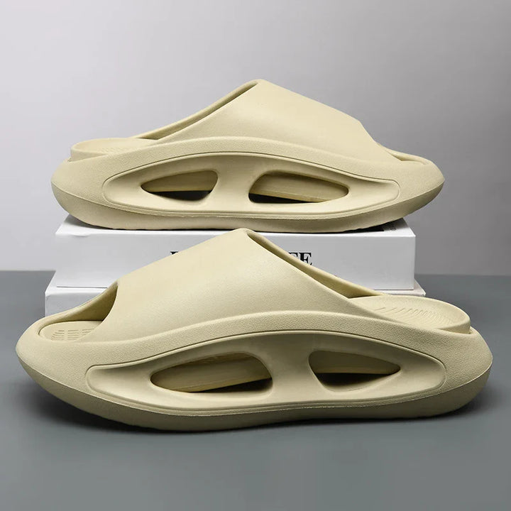 Close-up of the textured sole of a lightweight EVA cloud slide, highlighting its comfort and open-toe design.