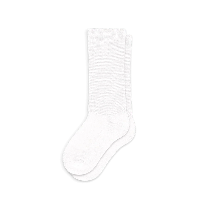 Multiple pairs of white comfort compression socks stacked, representing their availability for health and wellness.