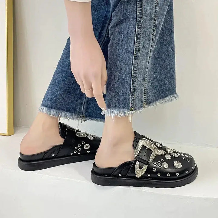 Stylish black studded platform sandals, a must-have for women's bold summer footwear.
