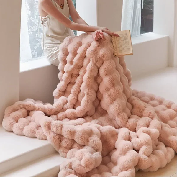 "Plush faux fur throw blanket in rich, elegant colors, ideal for winter warmth and stylish decor accents."