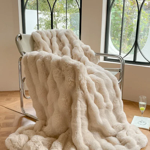 "Plush faux fur throw blanket in rich, elegant colors, ideal for winter warmth and stylish decor accents."