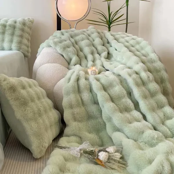 "Plush faux fur throw blanket in rich, elegant colors, ideal for winter warmth and stylish decor accents."