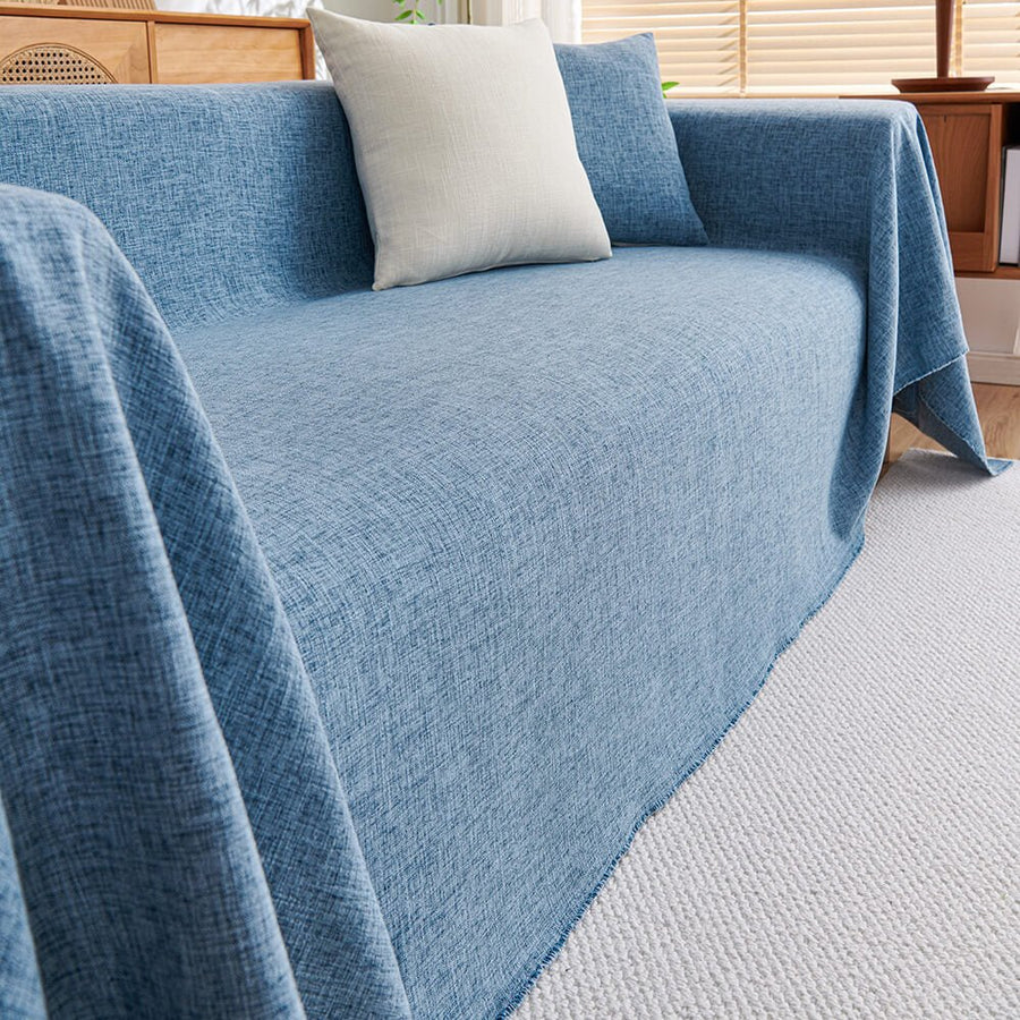 Elegant green premium cotton linen sectional sofa cover, a washable and pet-friendly furniture protector for L-shape couches.