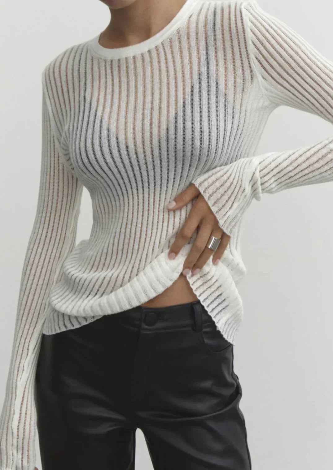 White sheer ribbed long sleeve top for women, versatile and chic. Perfect fitted top for modern elegant style.