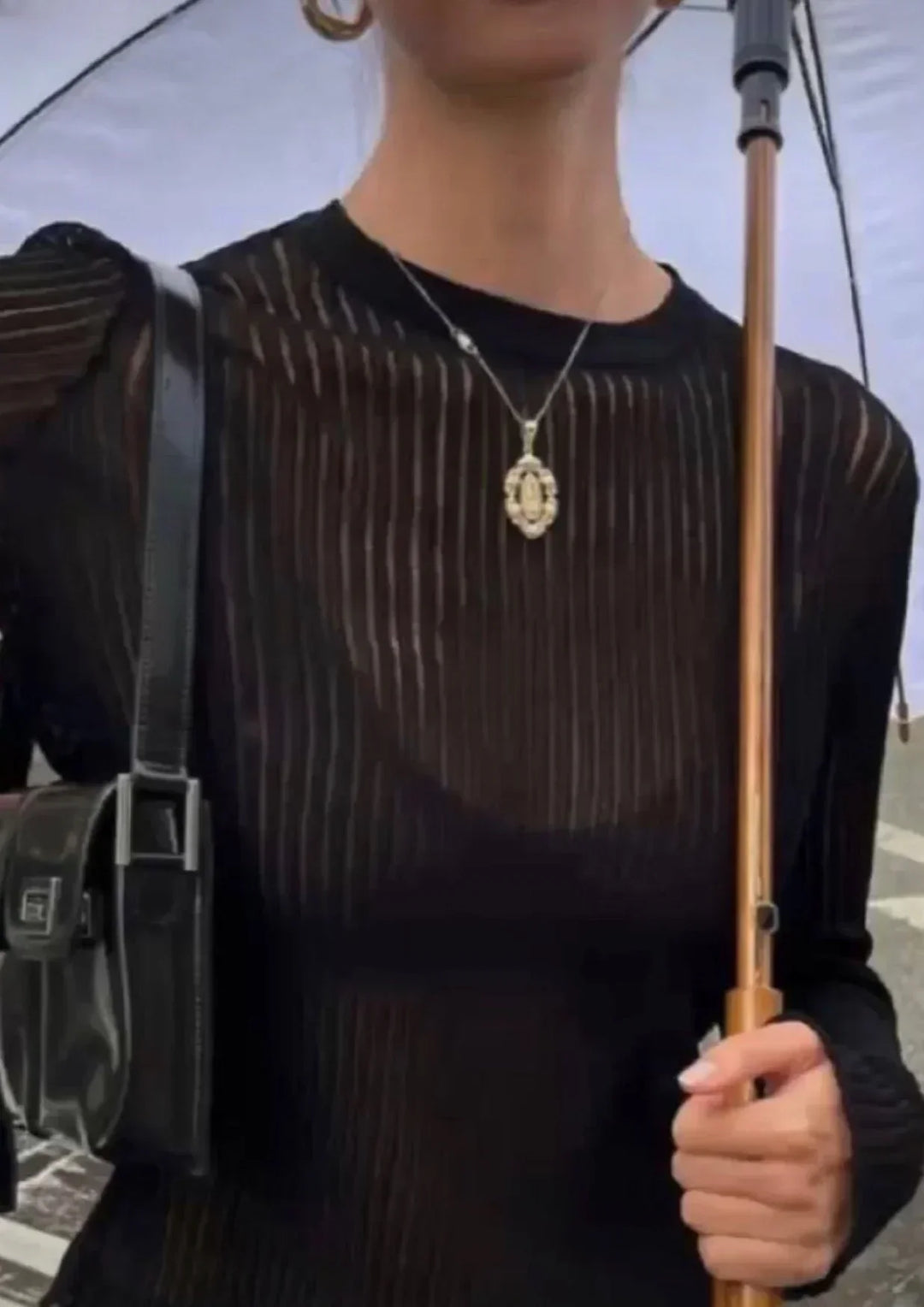 Versatile women's sheer ribbed long sleeve top for effortless, chic style. Modern apparel, perfect for day to night.