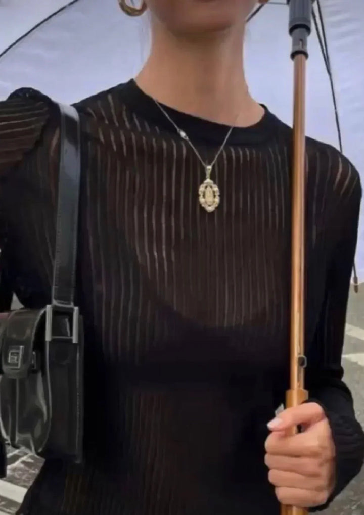 Versatile women's sheer ribbed long sleeve top for effortless, chic style. Modern apparel, perfect for day to night.