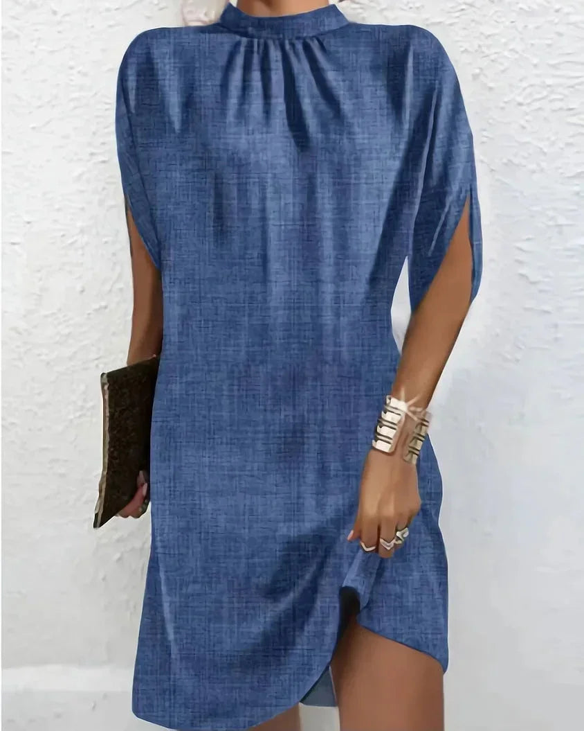 Party-ready women's dress: mock neck, mini length, and elegant cape sleeves.