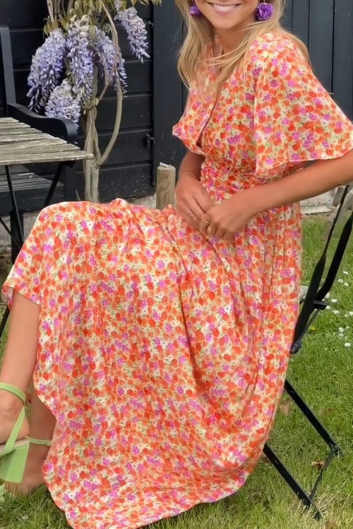Flowy elegant floral print maxi dress, a chic women's fashion choice for parties.