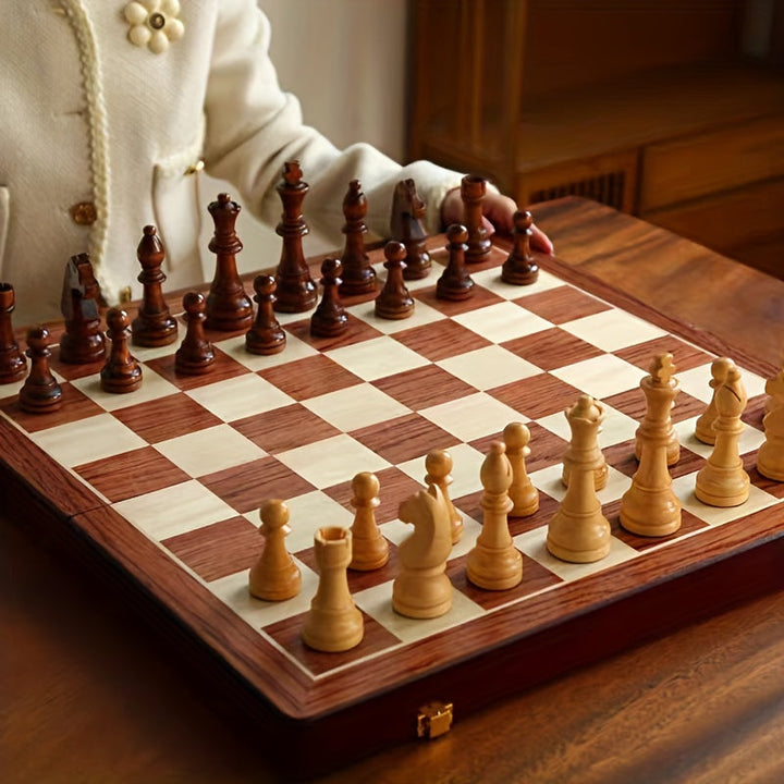 Foldable wooden chess set, ideal travel game & elegant gift, with classic board & solid wood pieces.