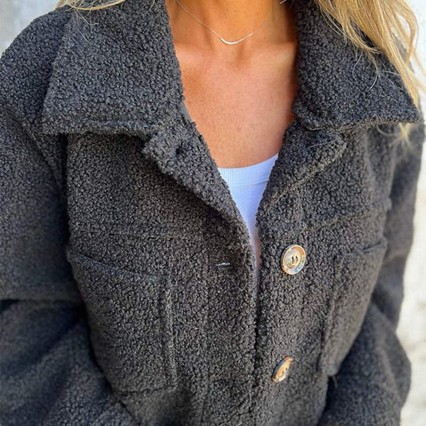 Sophisticated women's short jacket with a classic lapel collar and practical button closure.