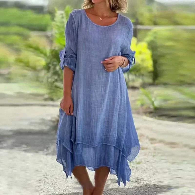 Elegant pink layered midi dress for women, featuring comfortable 3/4 sleeves and an asymmetric hem.