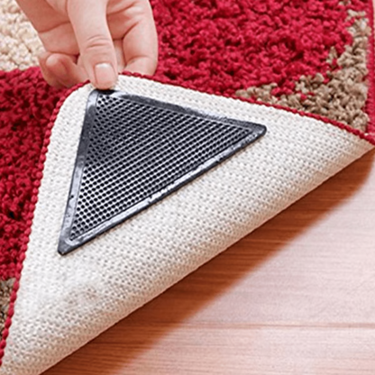 "Square non-slip rug gripper pads on light surface, self-adhesive and residue-free, ensuring rugs stay secure on all floors."
