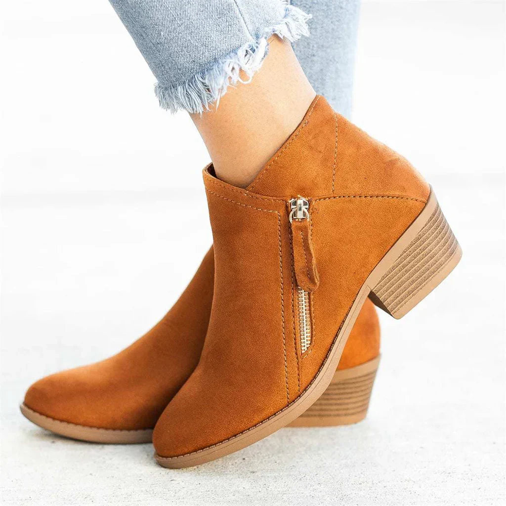 Modern bone-colored women's ankle boots with a unique zip heel design, versatile and stylish footwear.
