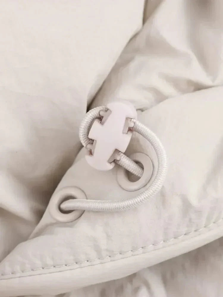 White cropped insulated puffer jacket for women, a versatile and essential piece of winter outerwear