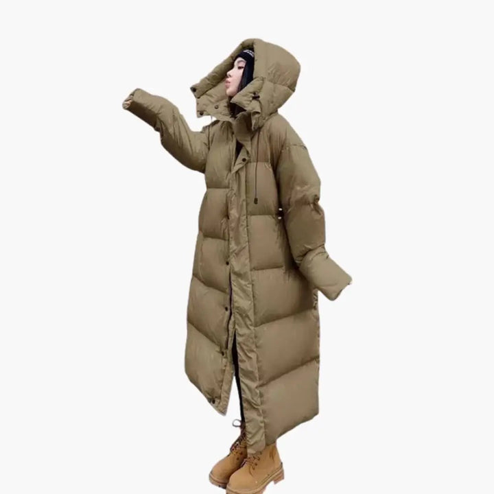 Oversized women's quilted puffer jacket, a long winter coat providing ultimate warmth and stylish outerwear.