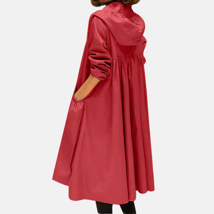 Versatile women's hooded knee-length rain jacket, water-resistant outerwear for protection during spring & autumn.