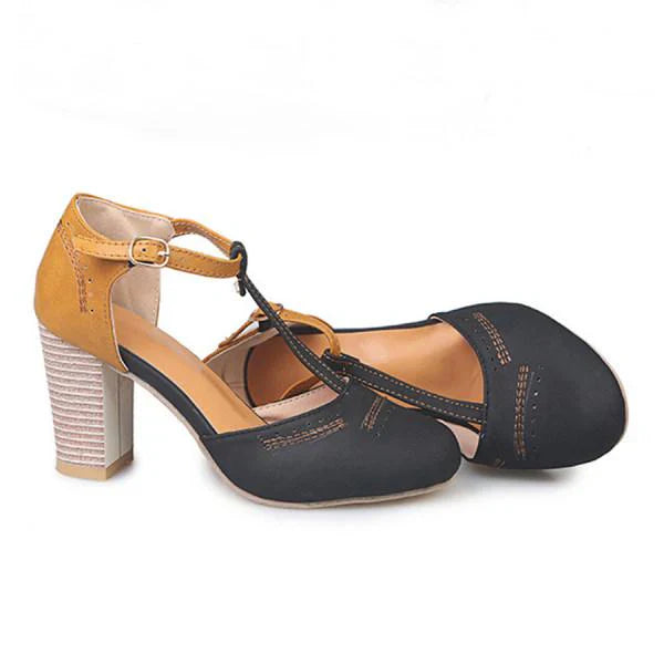 "T-Strap block heels with vintage charm, closed round toe, adjustable ankle buckle, faux suede finish."