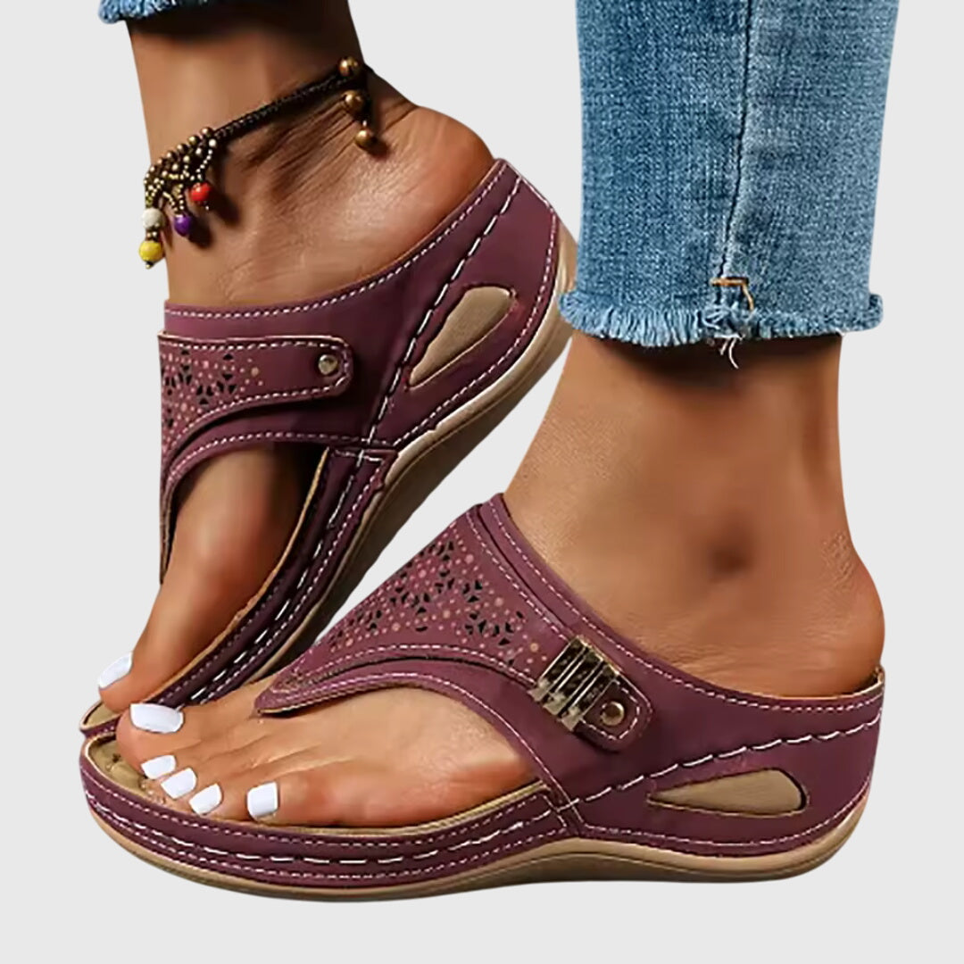 Theodoros women's platform sandals with a chunky heel, stylish ankle strap & perforated design for daily wear.