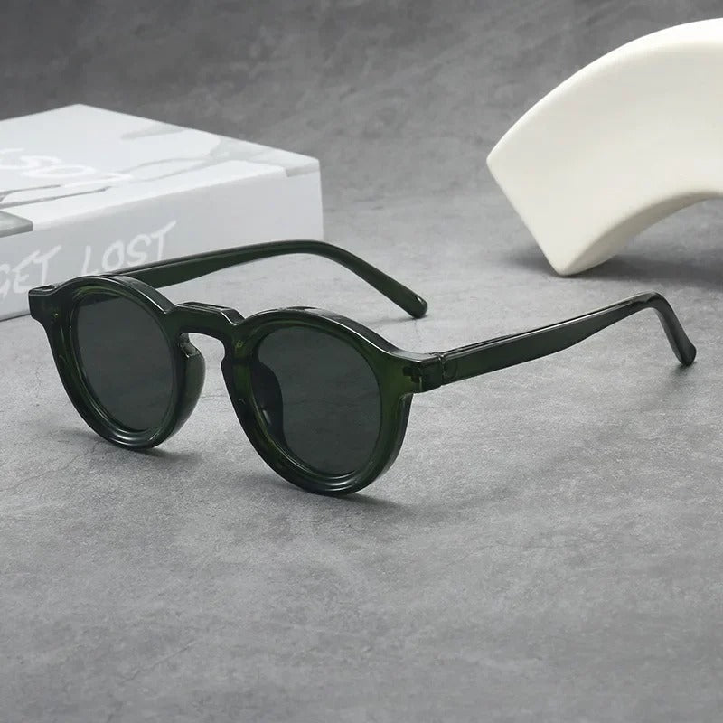 Lightweight unisex round tinted sunglasses ensuring comfort & style. Essential everyday eyewear accessory.