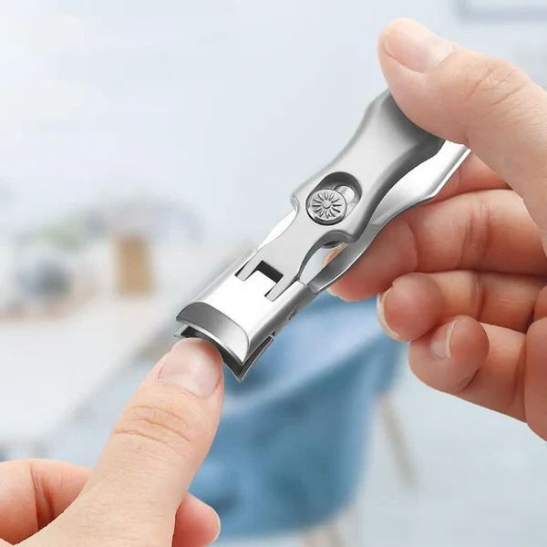"Ultra sharp nail cutter for thick nails, silver color, ergonomic design, wide jaw, carbon steel blades, beauty tool."