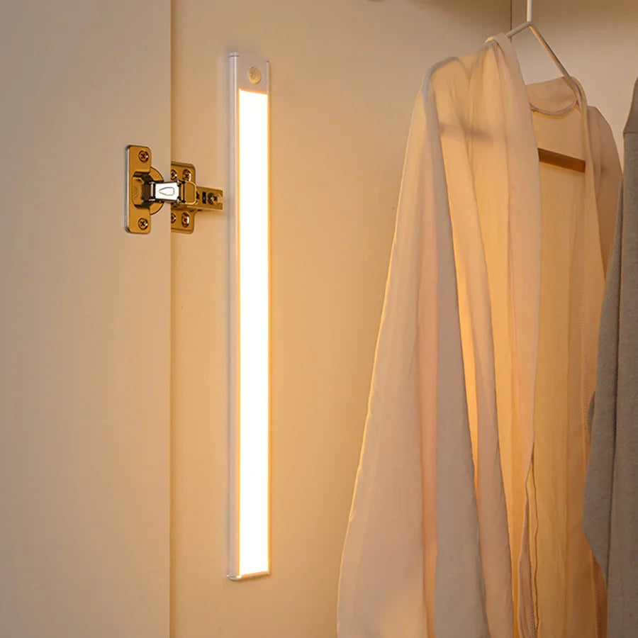 Ultra-slim motion sensor cabinet light in sleek aluminum, black or silver, 9mm thick, 20-60cm, versatile, hands-free.